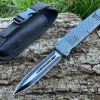 couteau automatique OTF carbone lame spear point 10 cm acier manche effet carbone brise vitre etui nylon